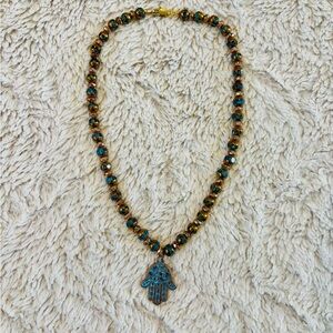 Elegant Beaded Necklace with Hamsa Pendant